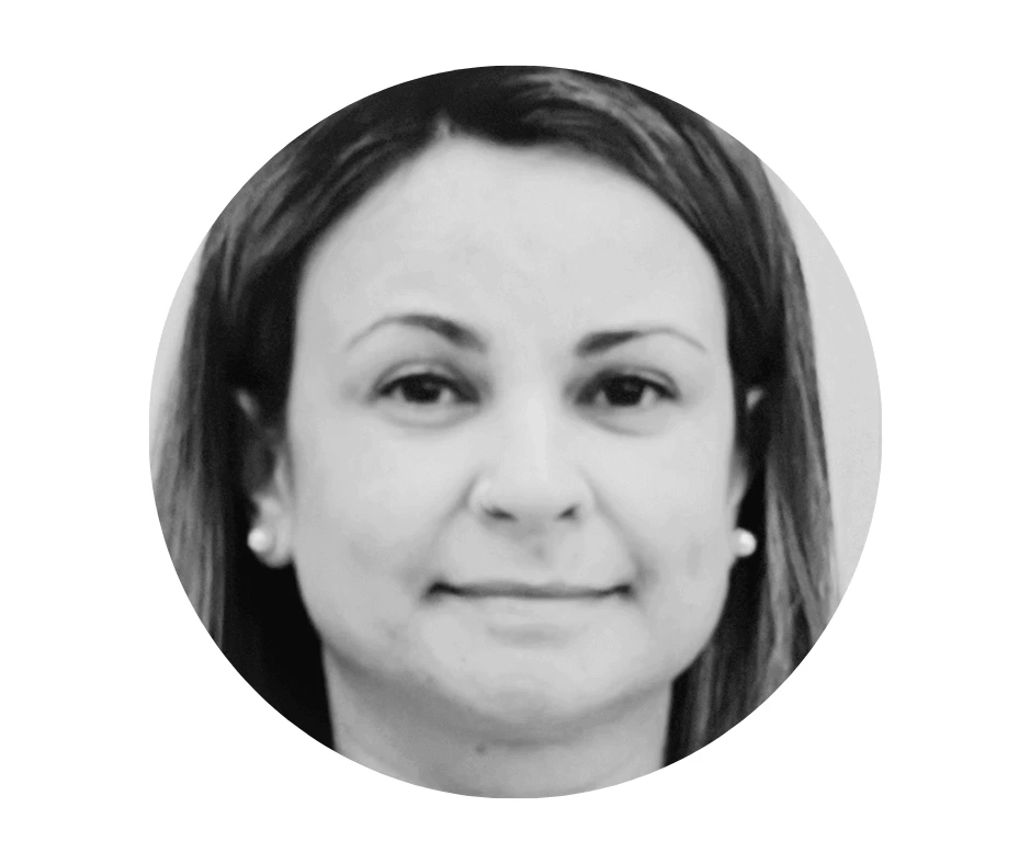 Meet our Babysitters Black and white headshot of a Cherished Cherubs Babysitter with straight hair, wearing pearl earrings and a neutral expression, shown inside a circular frame—capturing the timeless elegance often celebrated by Cherished Cherubs.