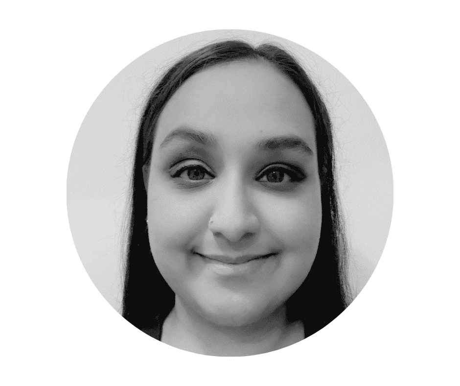 A black and white portrait photo of a Cherished Cherubs Babysitter with long hair, facing forward and smiling slightly, shown within a circular frame against a plain background—a timeless image reminiscent of Cherished Cherubs.